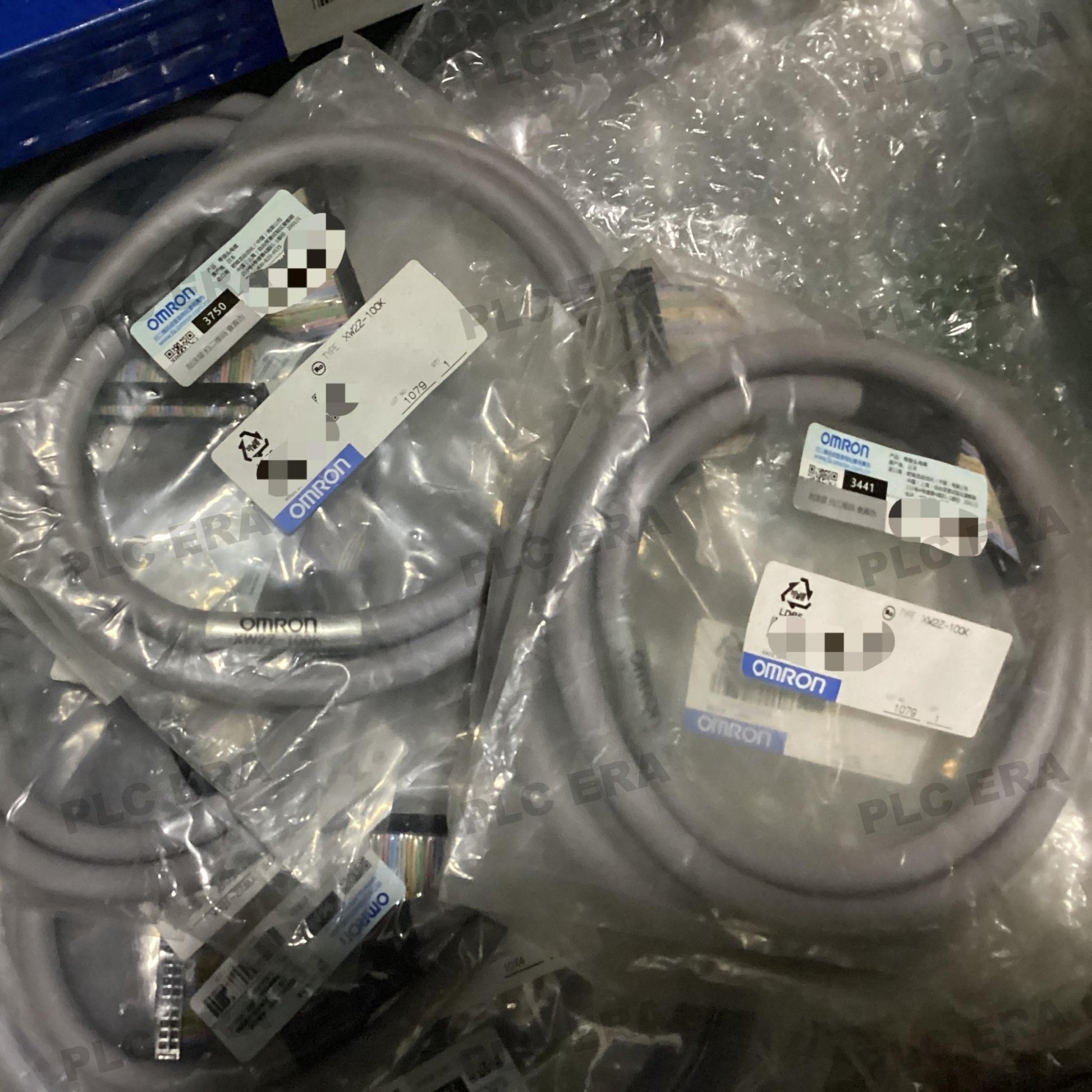 PLC ERA warehouse stocked with Original New Omron XW2Z-100K and industrial automation modules ready for global shipping